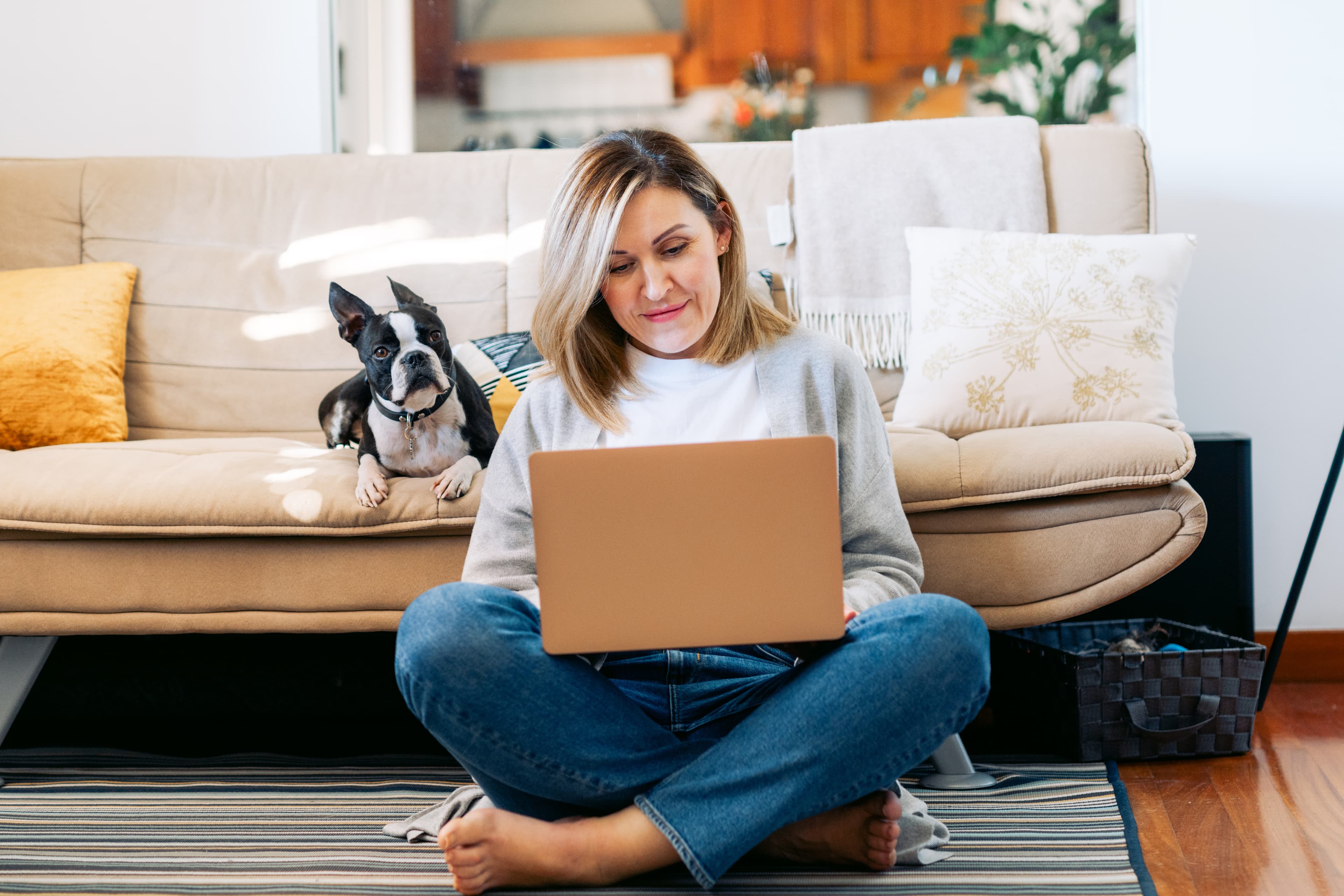 Person working from home with a dog resting calmly nearby